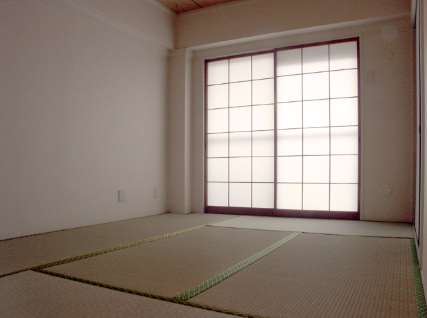 A plain tatami room with shoji screens glowing evenly with diffused daylight