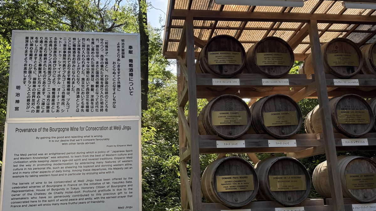 A wall of Burgundy wine barrels, each bearing its donor's name